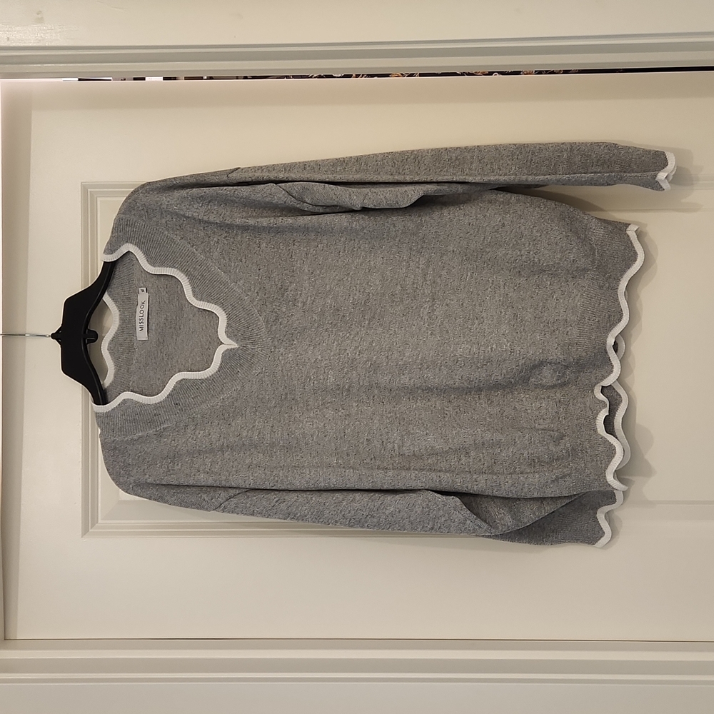 Grey sweater with white trim